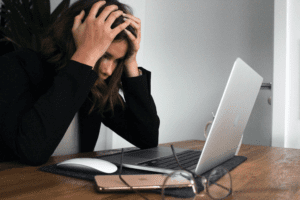 Business woman stressed at computer